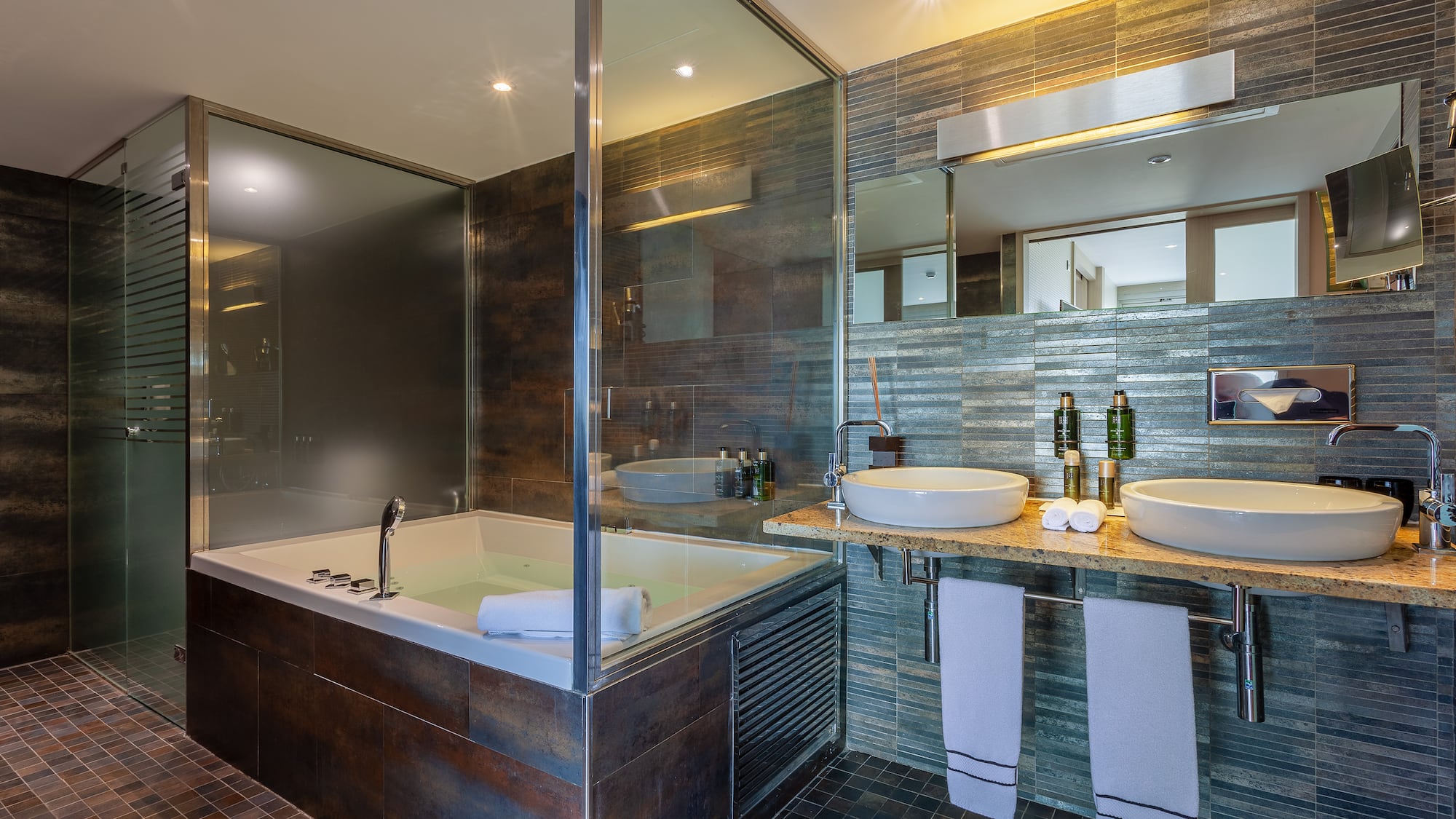 a bathroom with a tub and sink