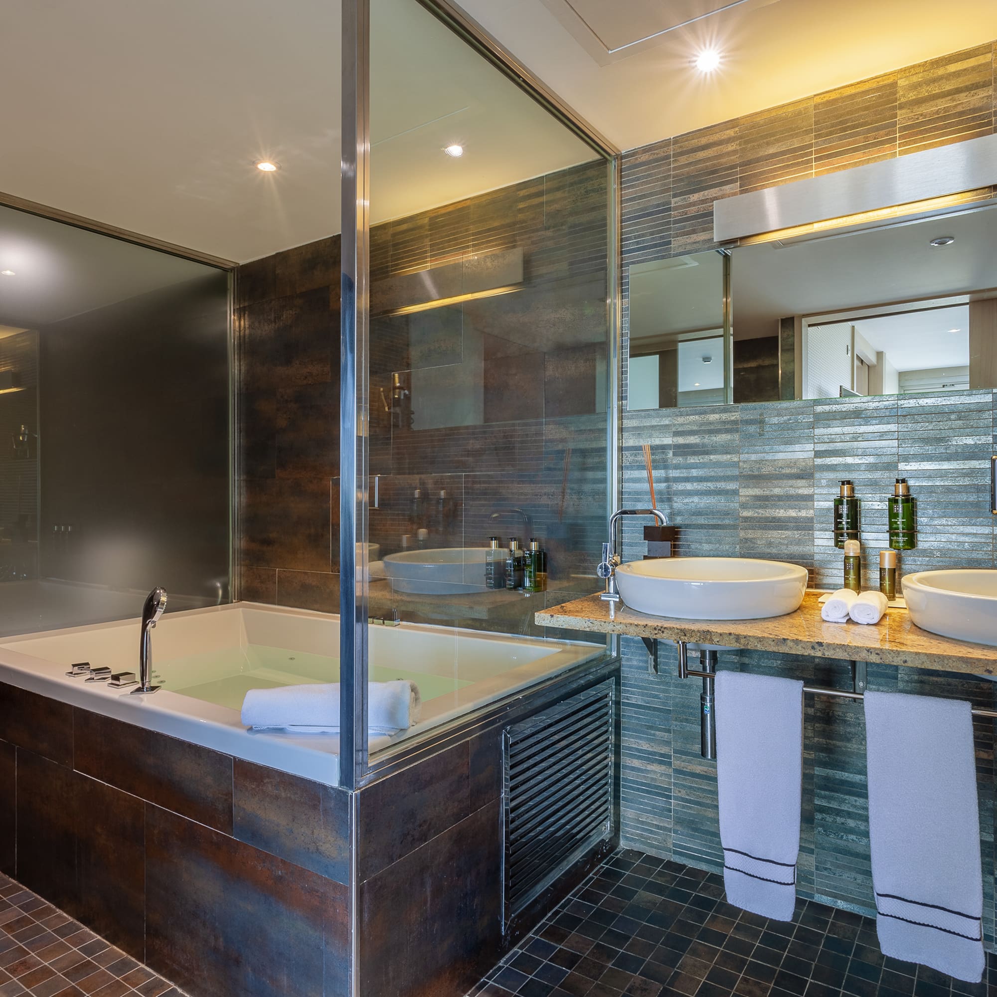 a bathroom with a tub and sink