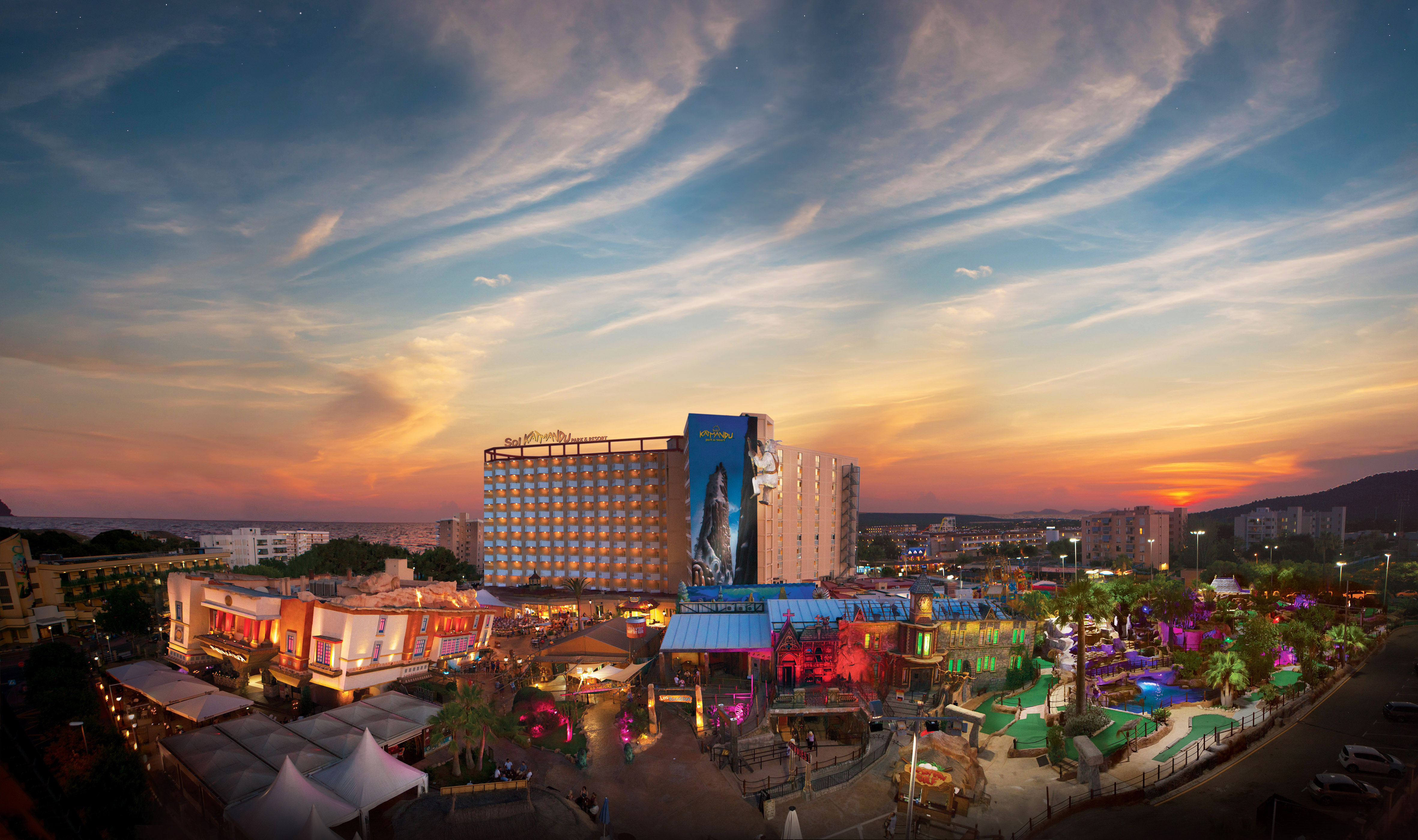 a large building with many lights and tents