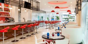 a restaurant with tables and chairs