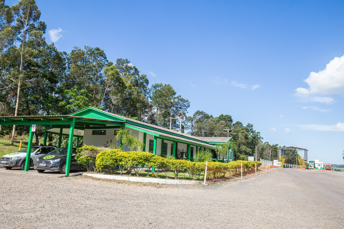 a building with a green roof and a green awning