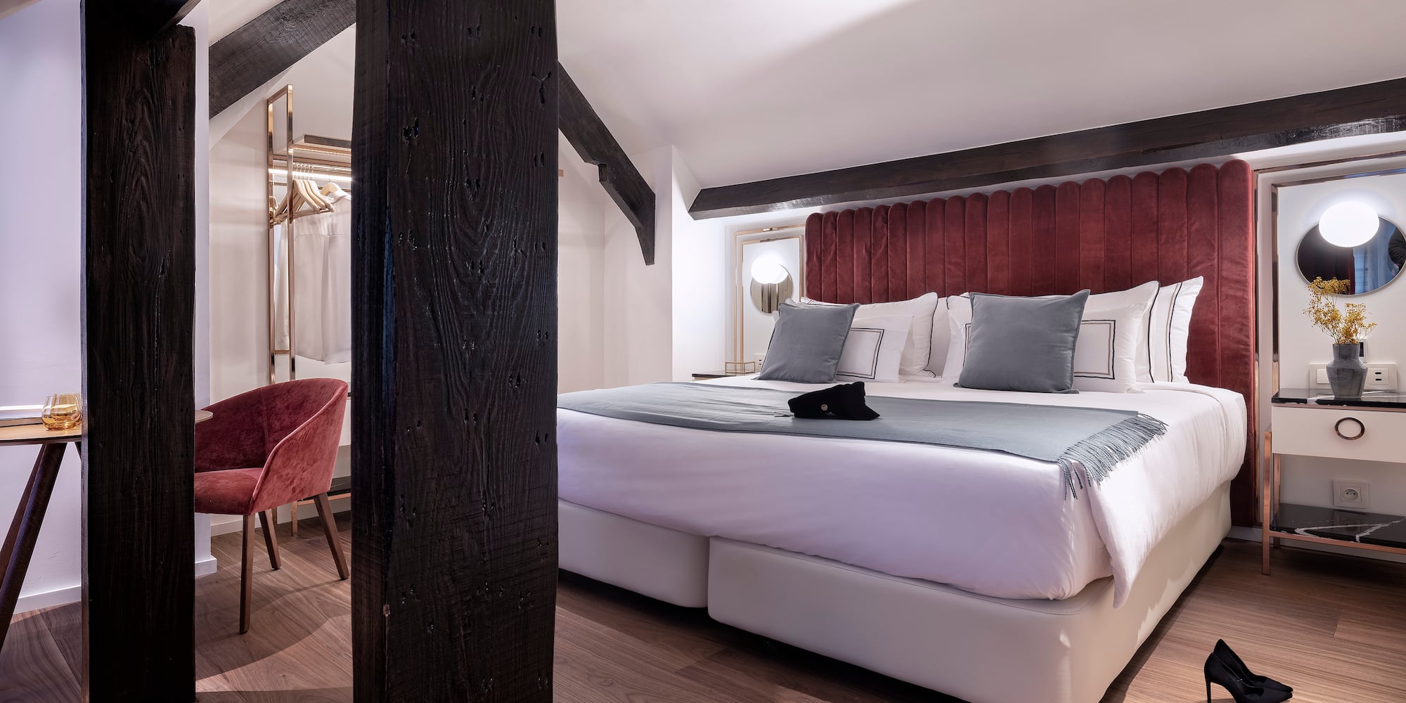 a bedroom with a bed and a chair