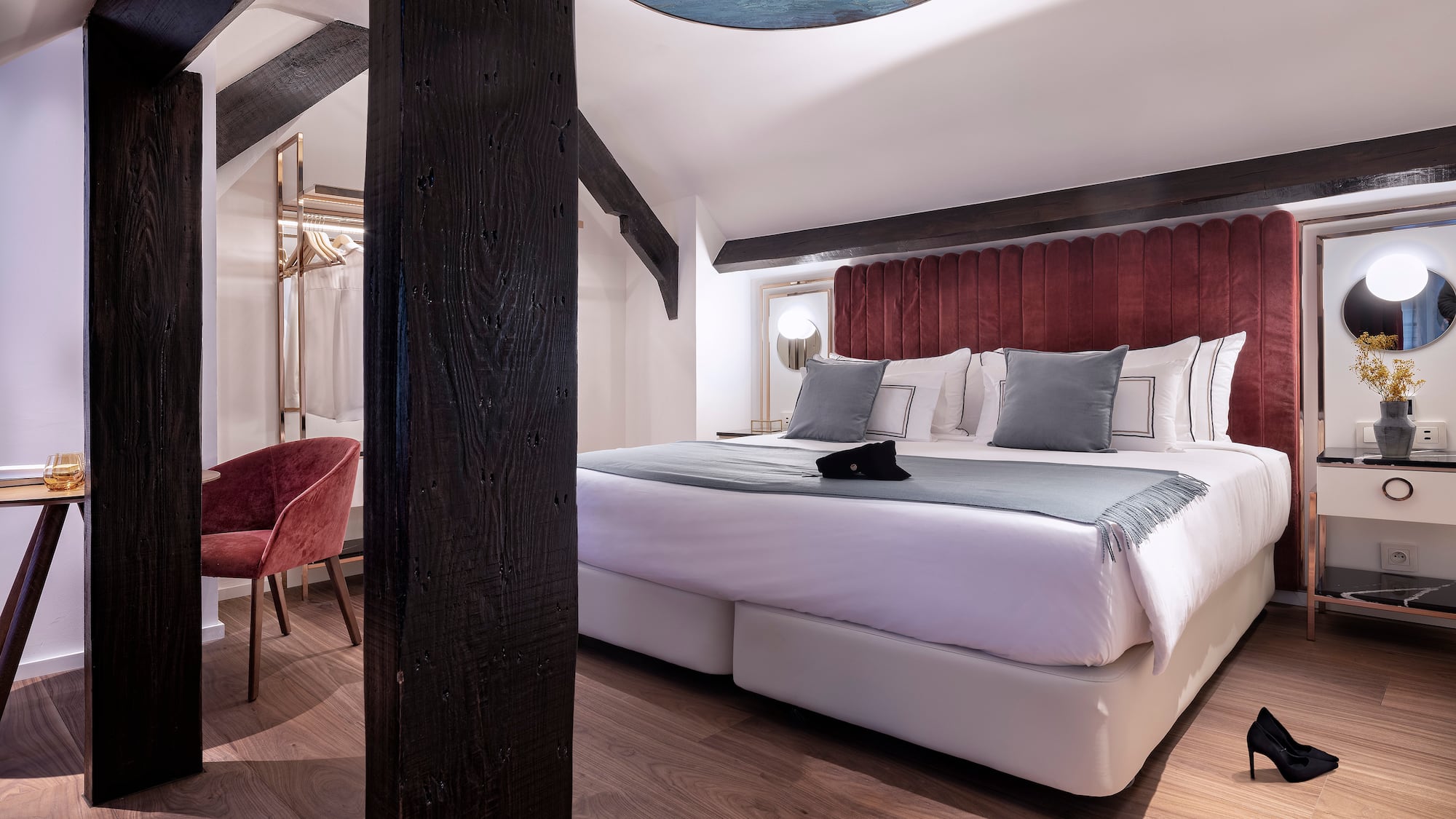 a bedroom with a bed and a chair