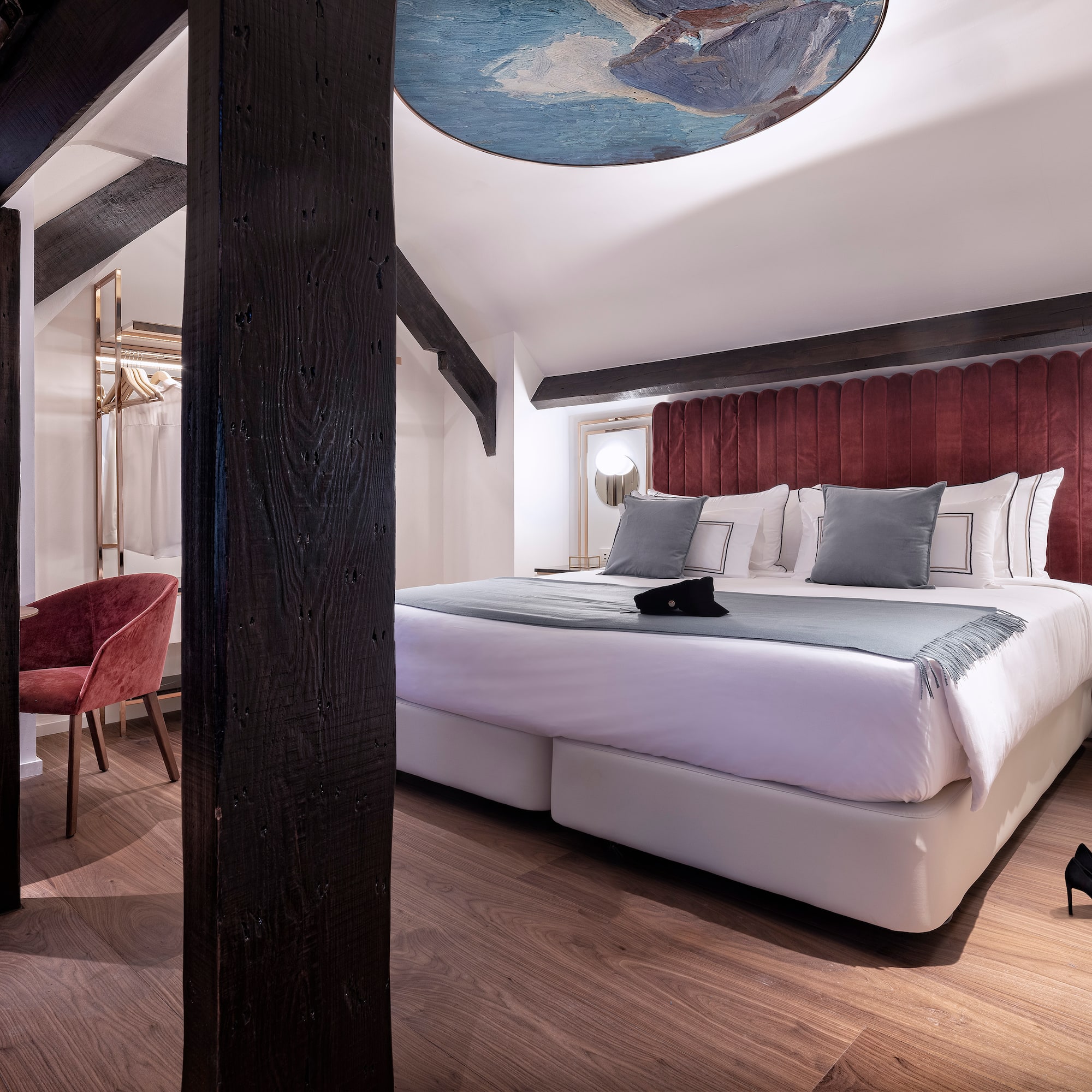 a bedroom with a bed and a chair