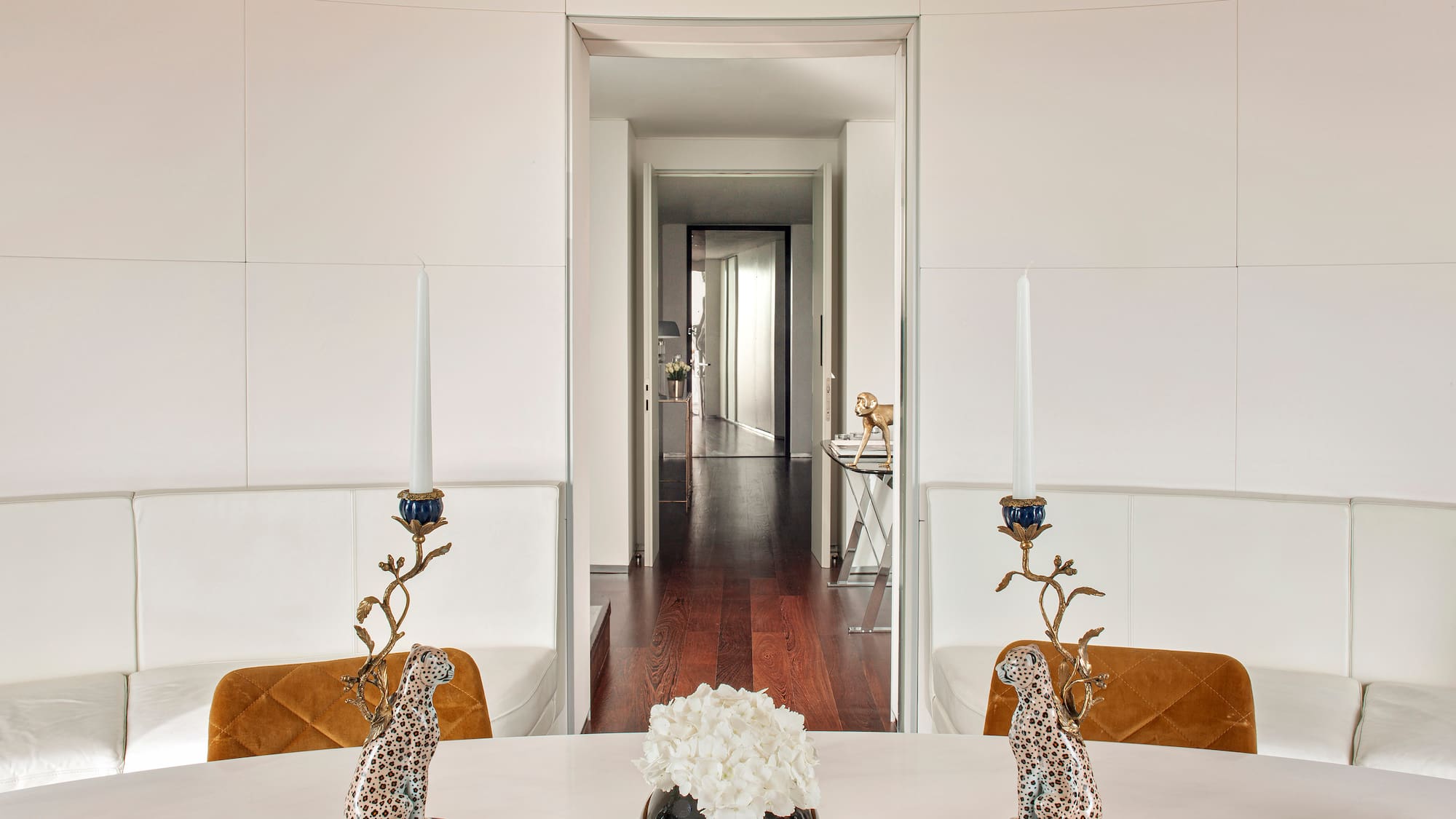 a table with candles and a vase of flowers