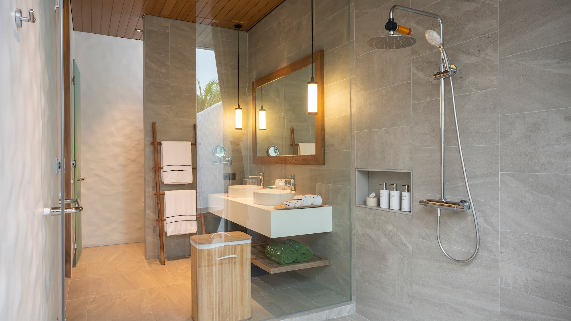 a bathroom with a shower and sink