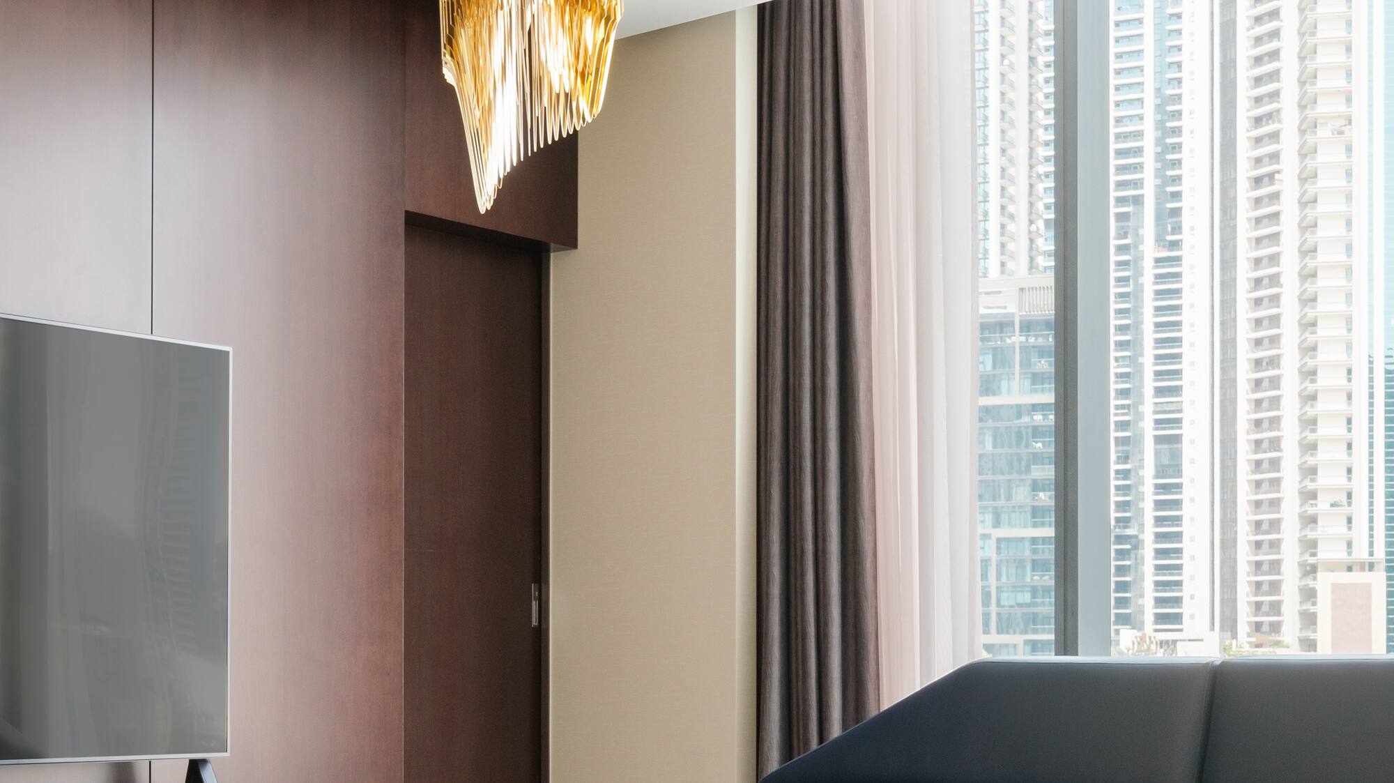 a living room with a television and a couch