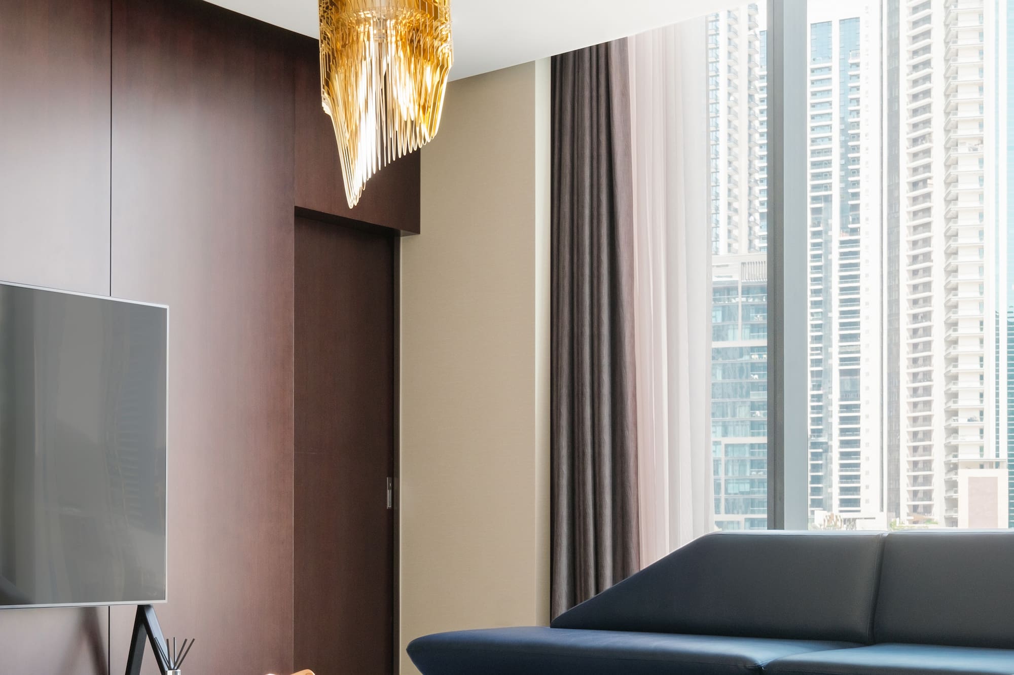 a living room with a television and a couch