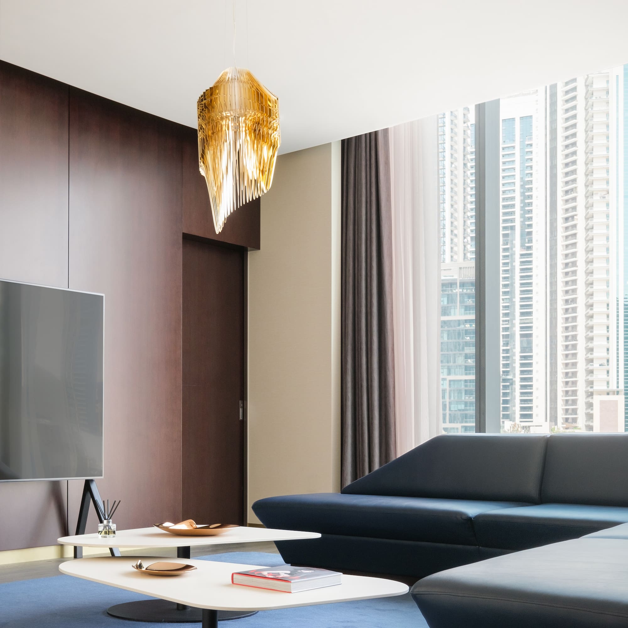 a living room with a television and a couch