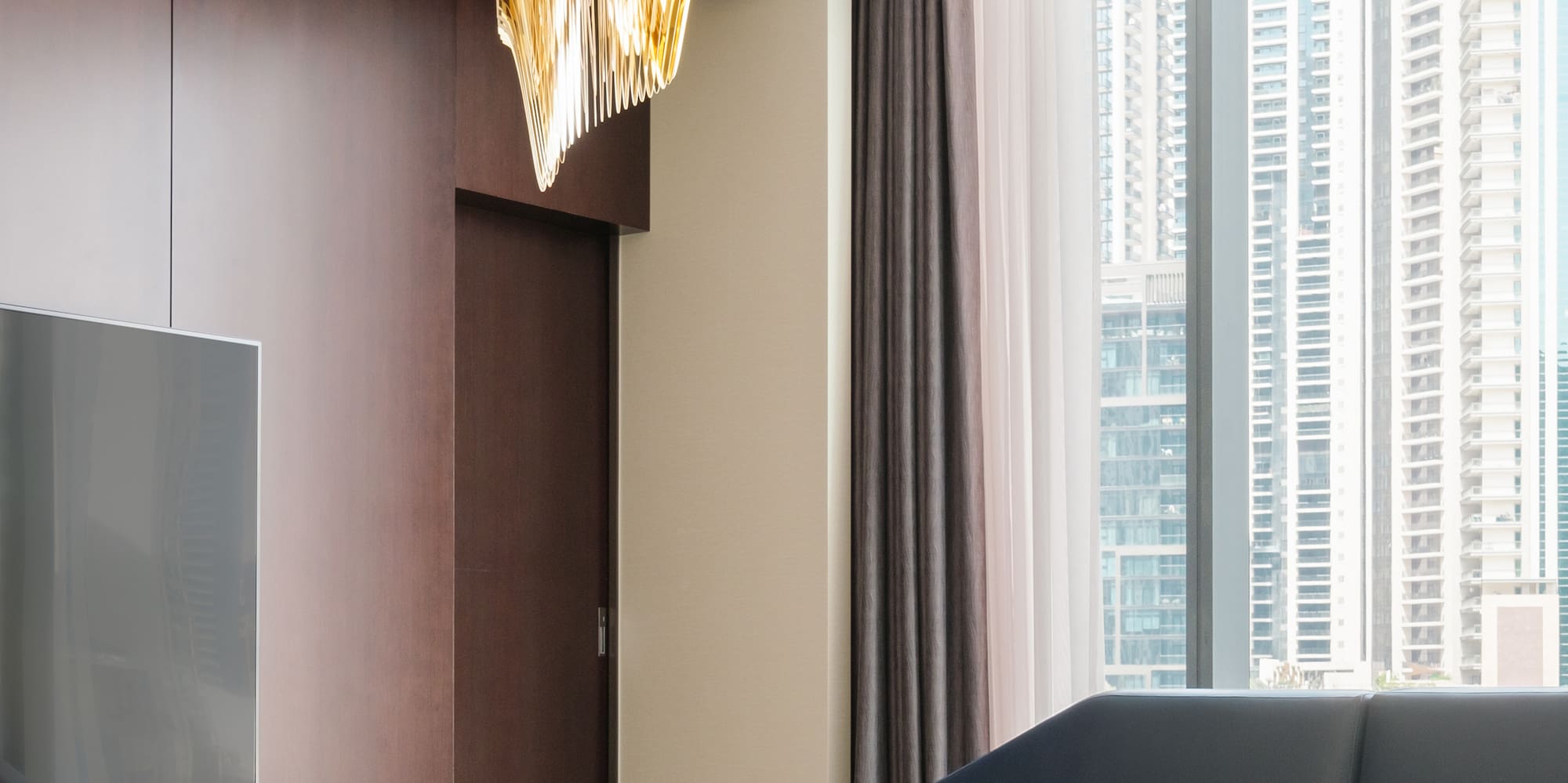 a living room with a television and a couch