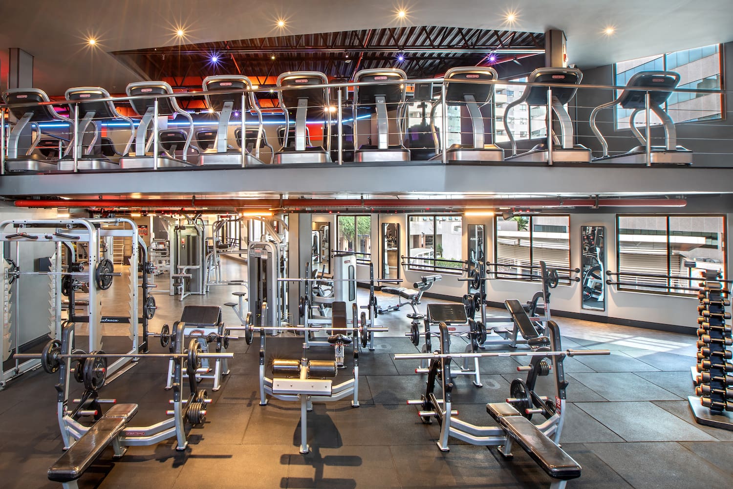 a large gym with several exercise equipment