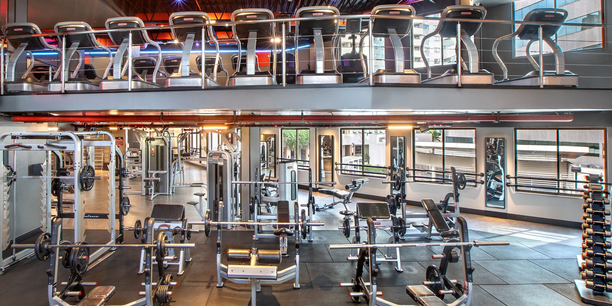 a large gym with several exercise equipment