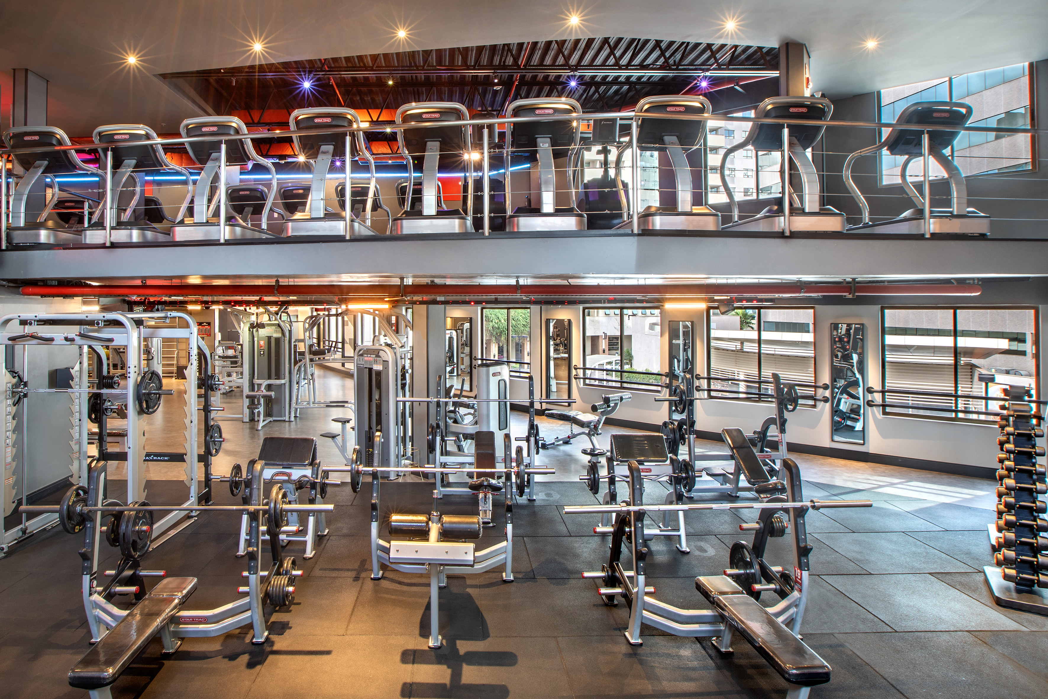 Modern two-level gym with cardio and strength training equipment. - Evolve Gym - -Hotel Madrid Airport Suites Affiliated by Meliá:, Brasilia