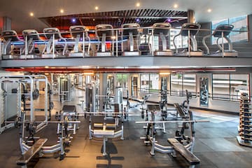 a large gym with several exercise equipment