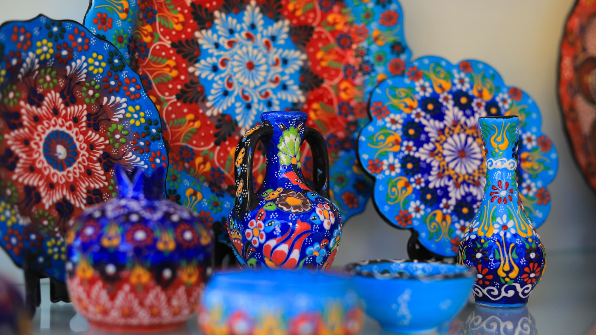 a collection of colorful pottery
