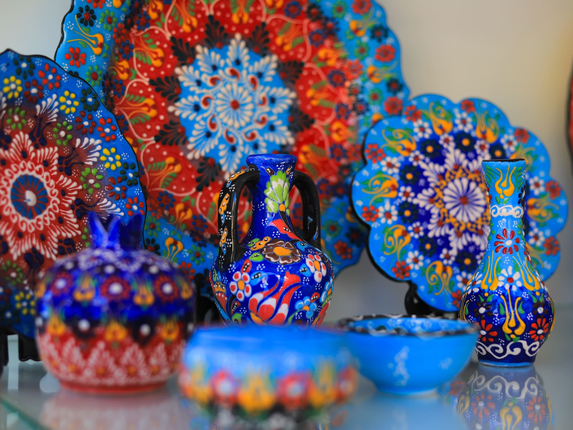 a group of colorful pottery