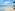 a beach with people and a boat