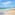 a beach with people and a boat