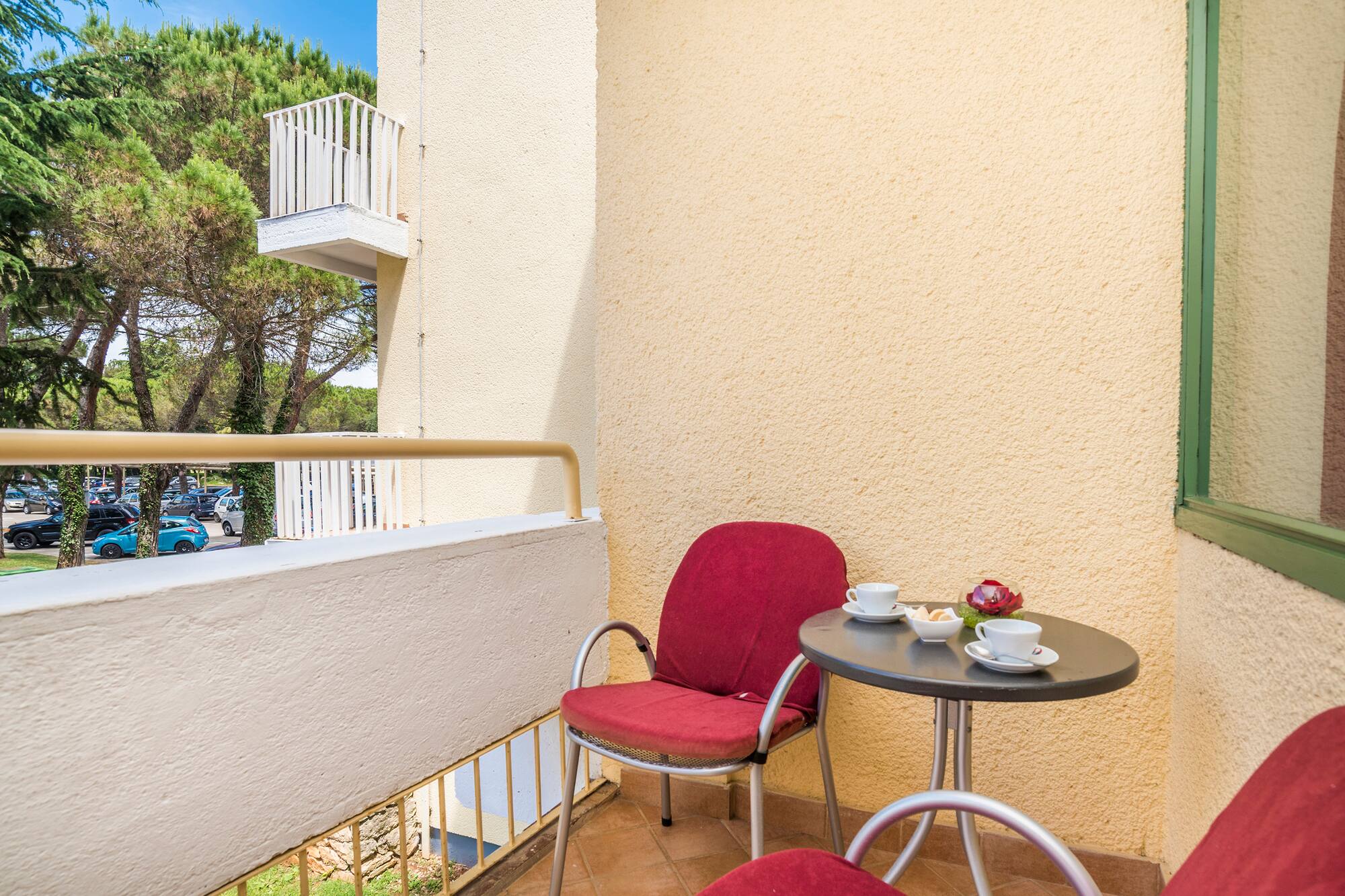 a table and chairs on a balcony