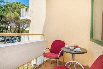 a table and chairs on a balcony