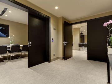 a room with black doors and carpet