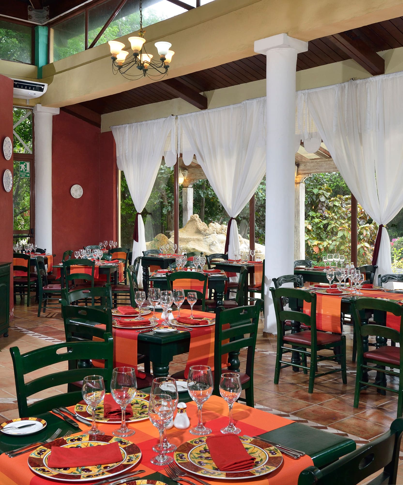 a restaurant with tables and chairs