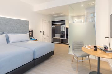 a bedroom with a glass partition