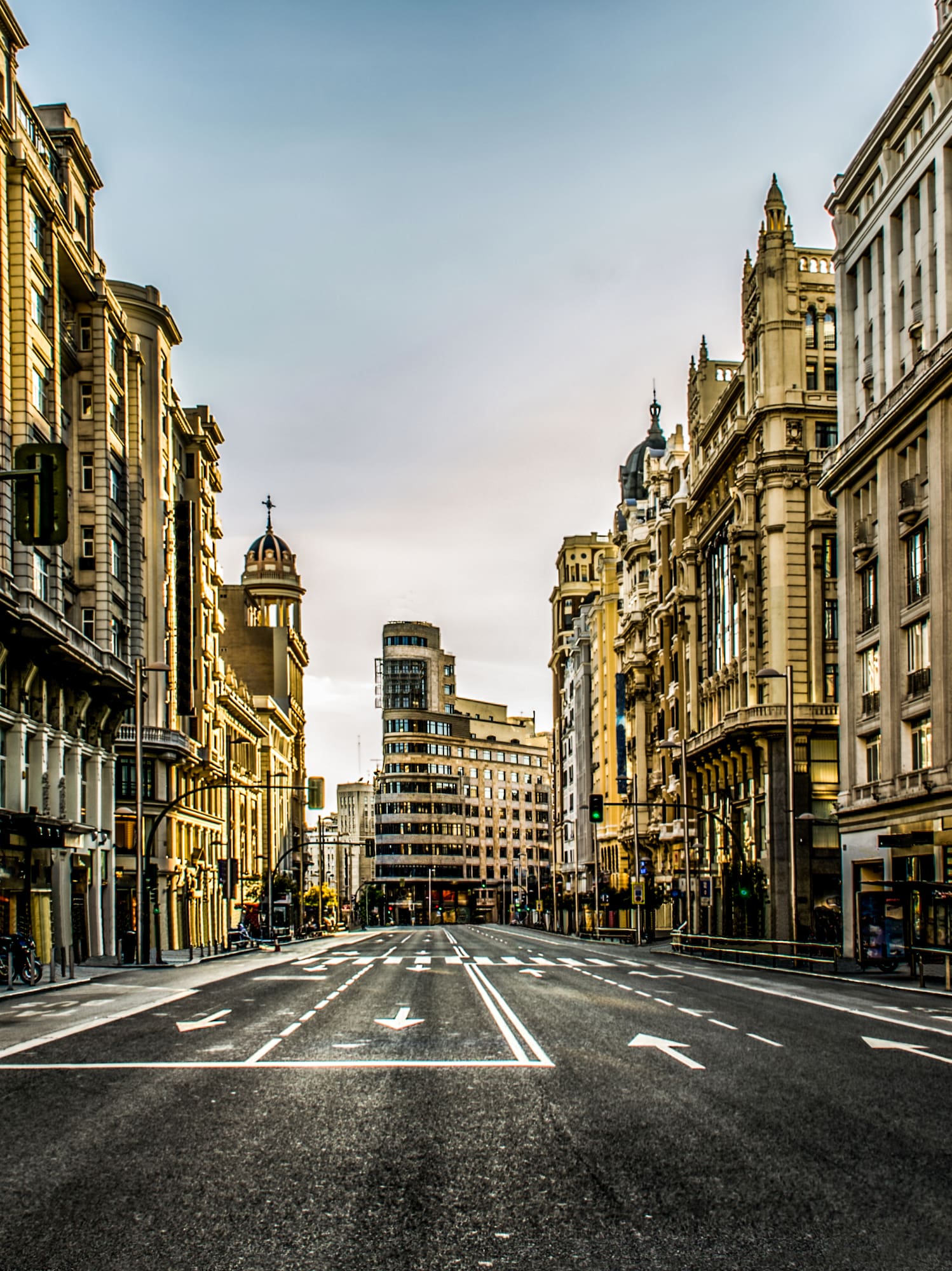 a street with buildings in the background