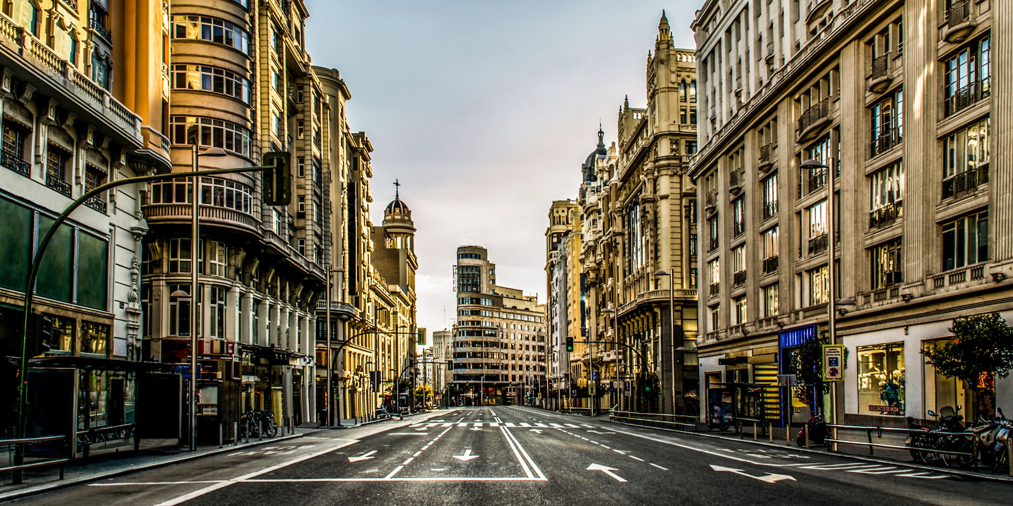 a street with buildings in the background