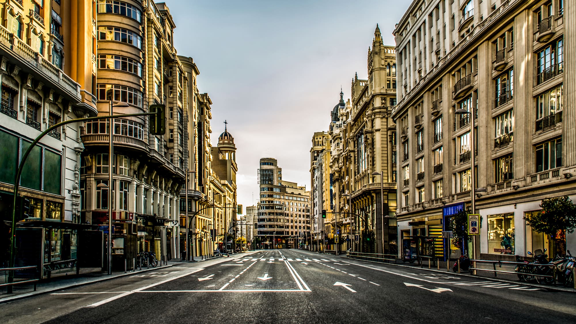 a street with buildings in the background