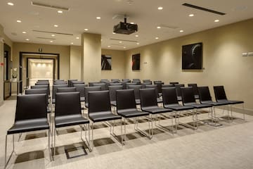 a room with black chairs