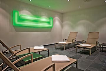 a room with chairs and a green light