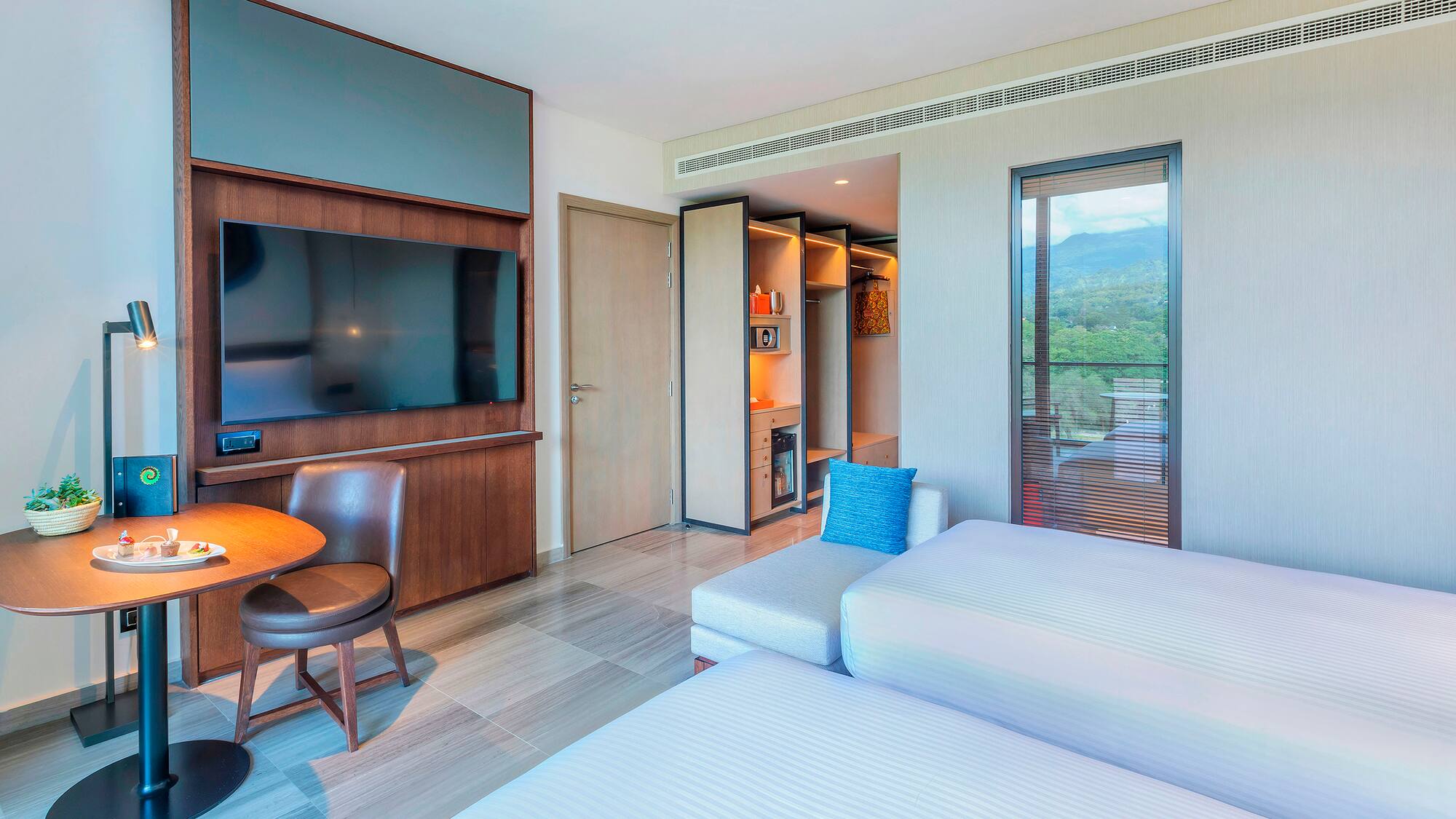 a room with a tv and a bed