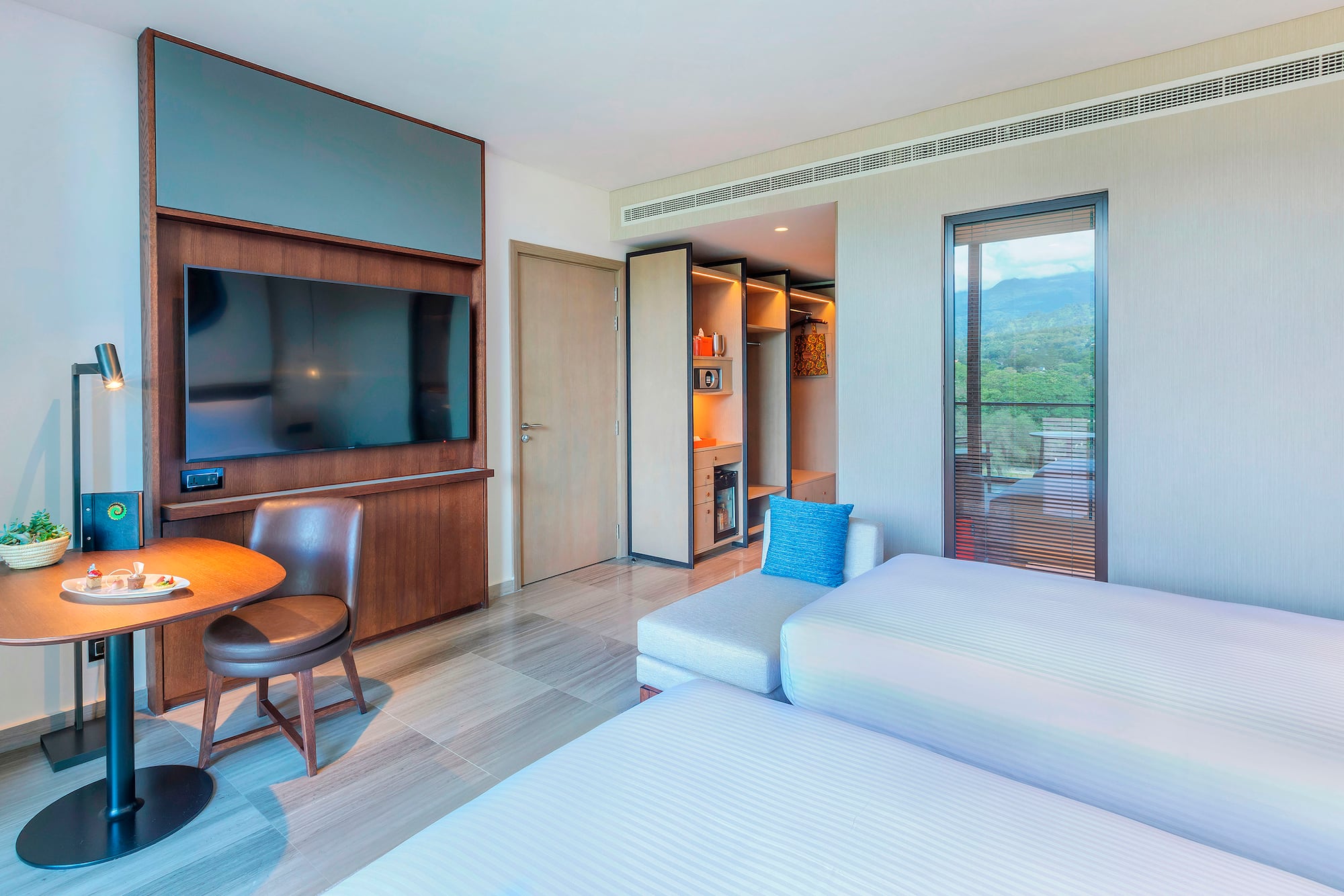 a room with a tv and a bed