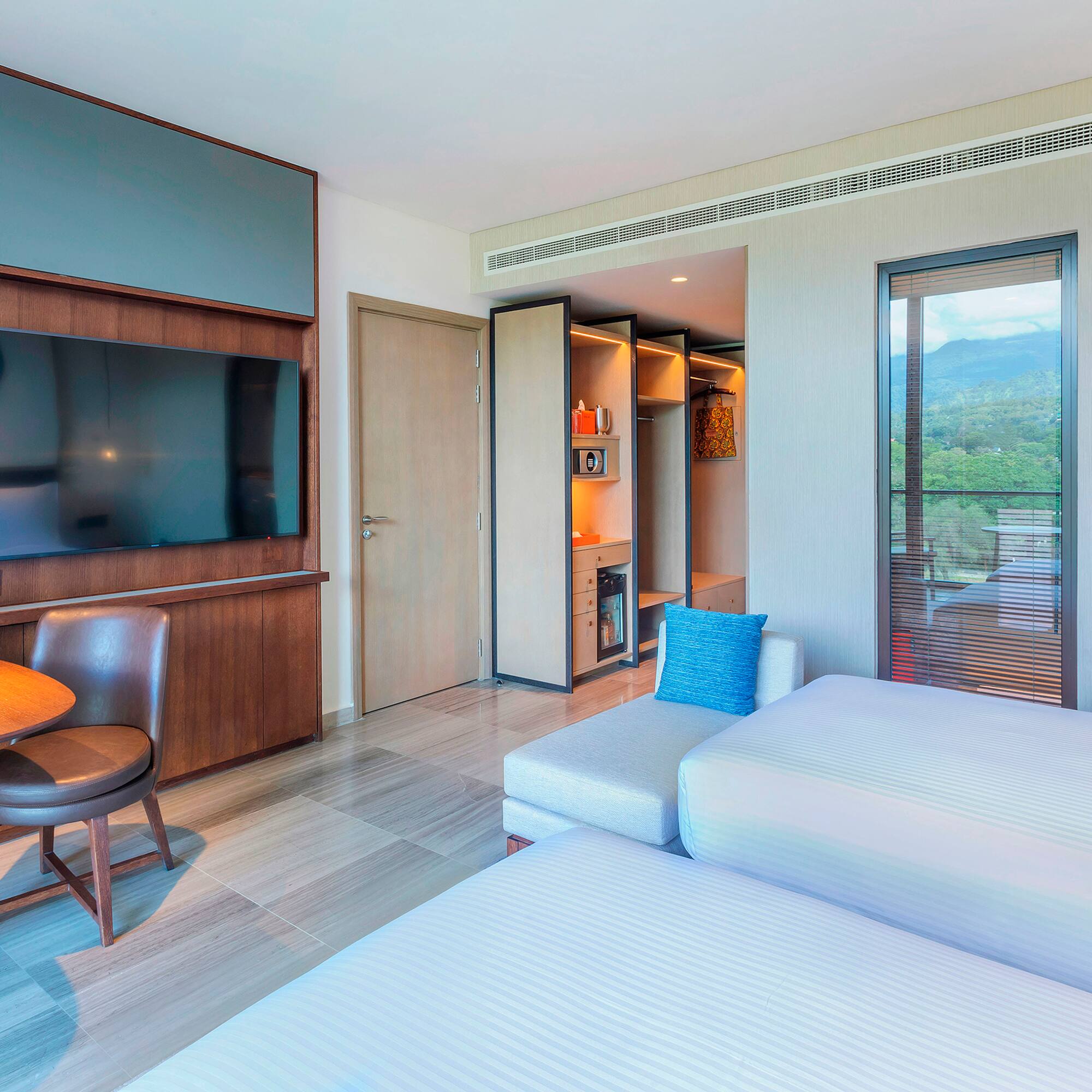 a room with a tv and a bed