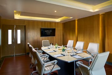 a conference room with a table and chairs