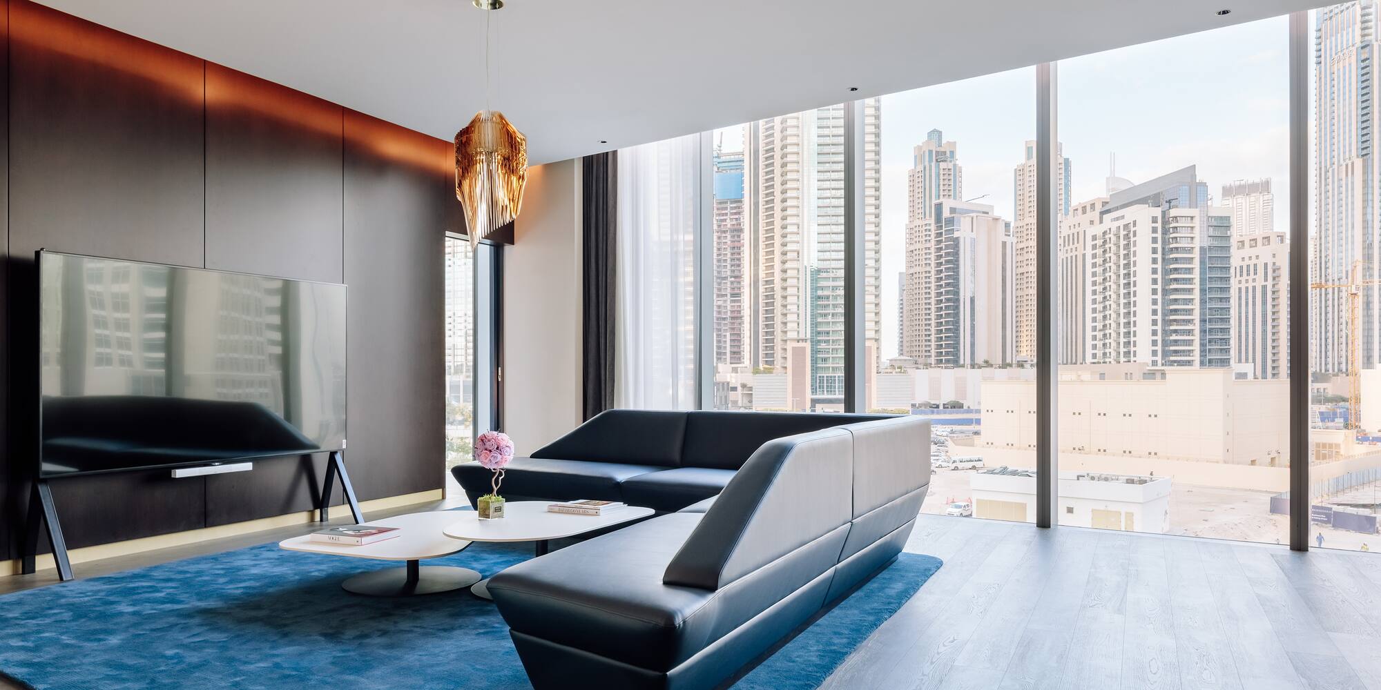 a living room with a couch and a tv