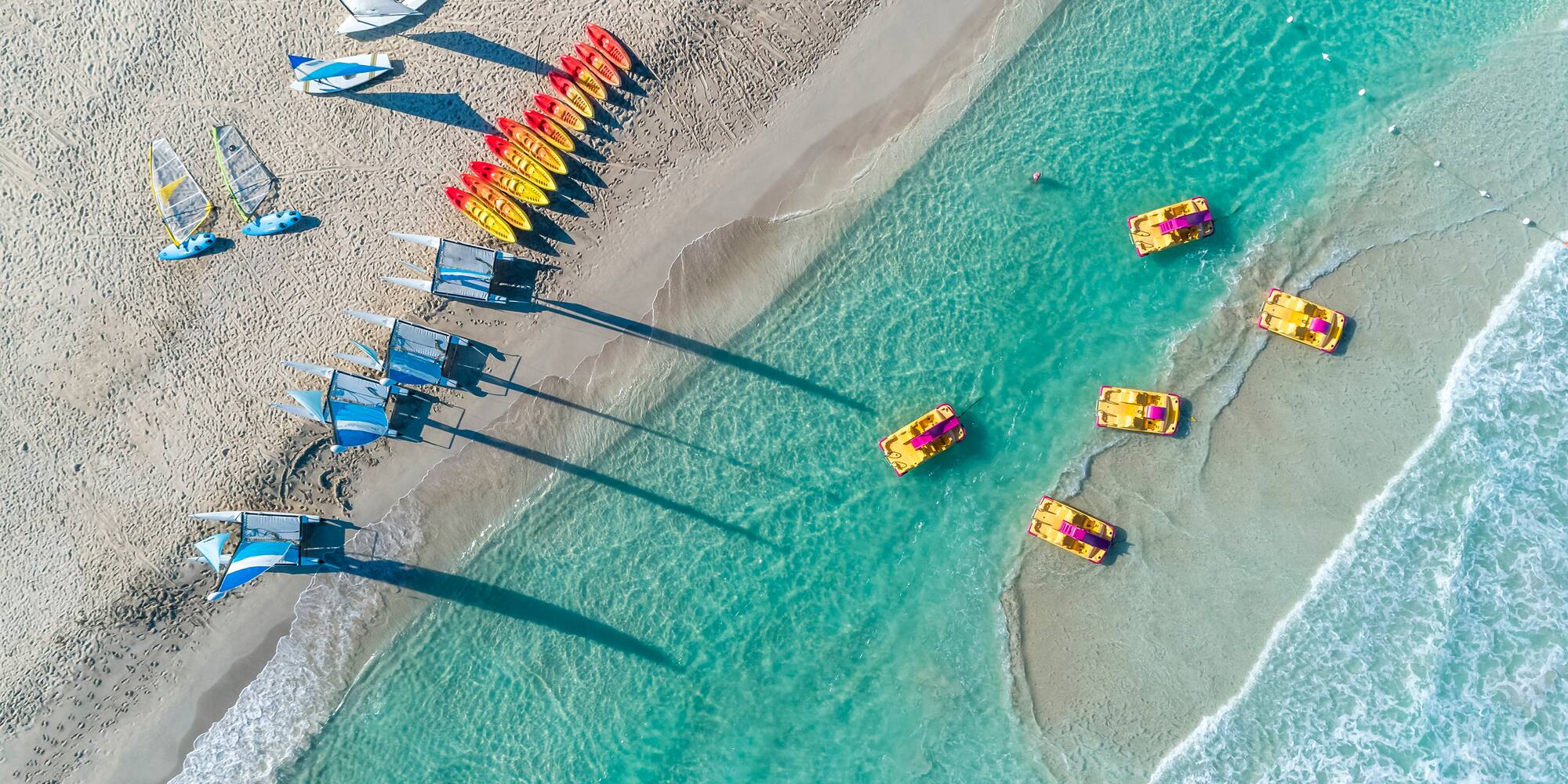 a group of boats on a beach
