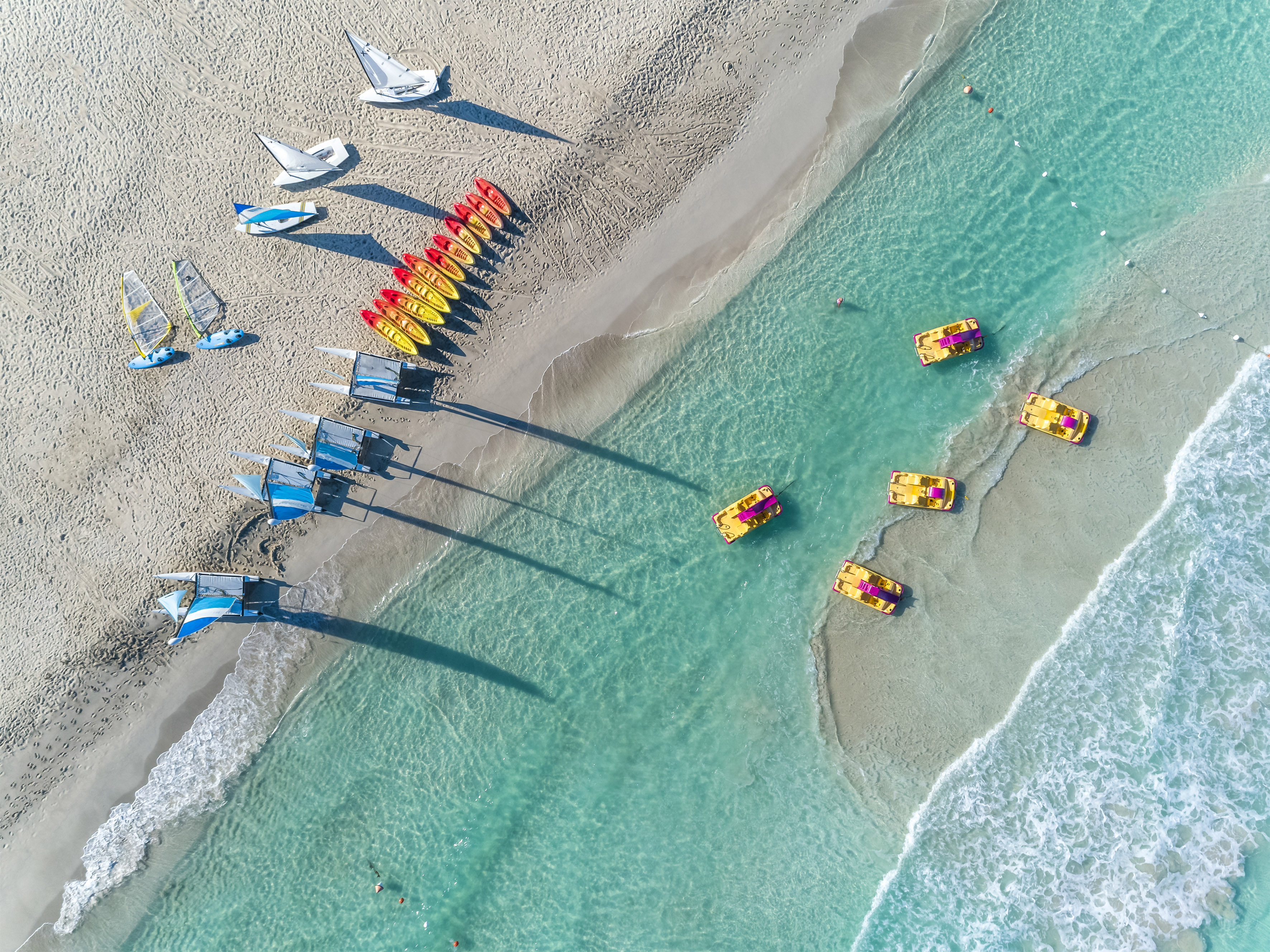 a group of boats on a beach