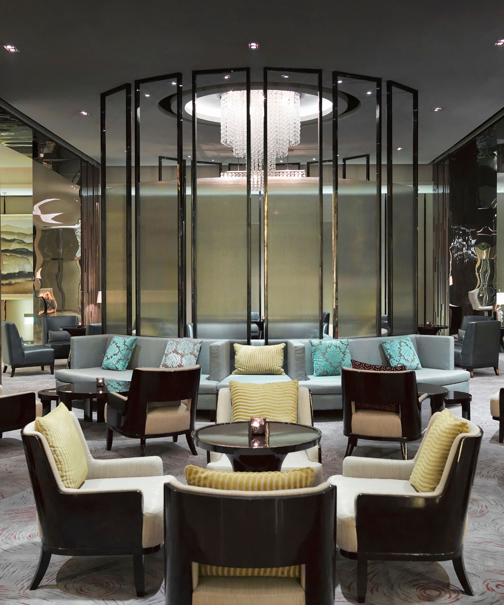 a room with a chandelier and chairs