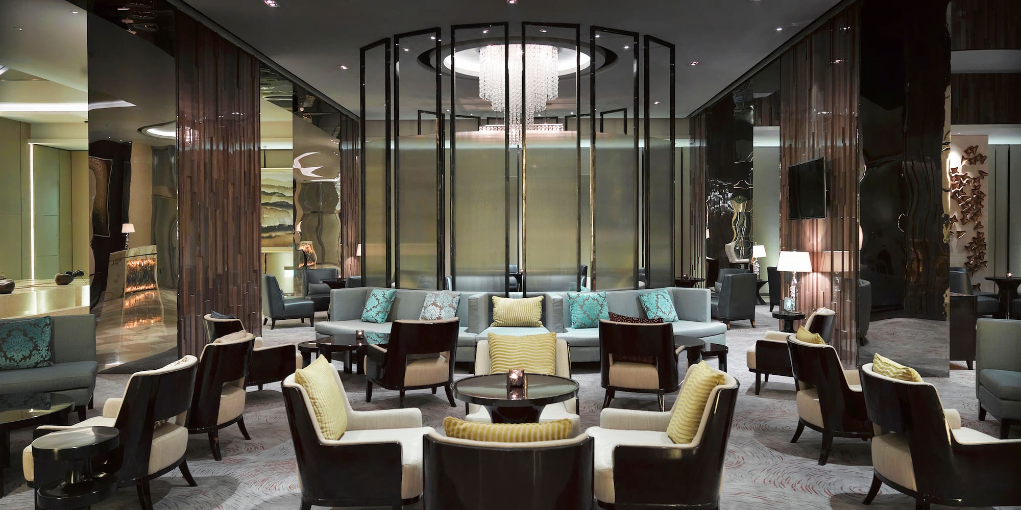 a room with a chandelier and chairs