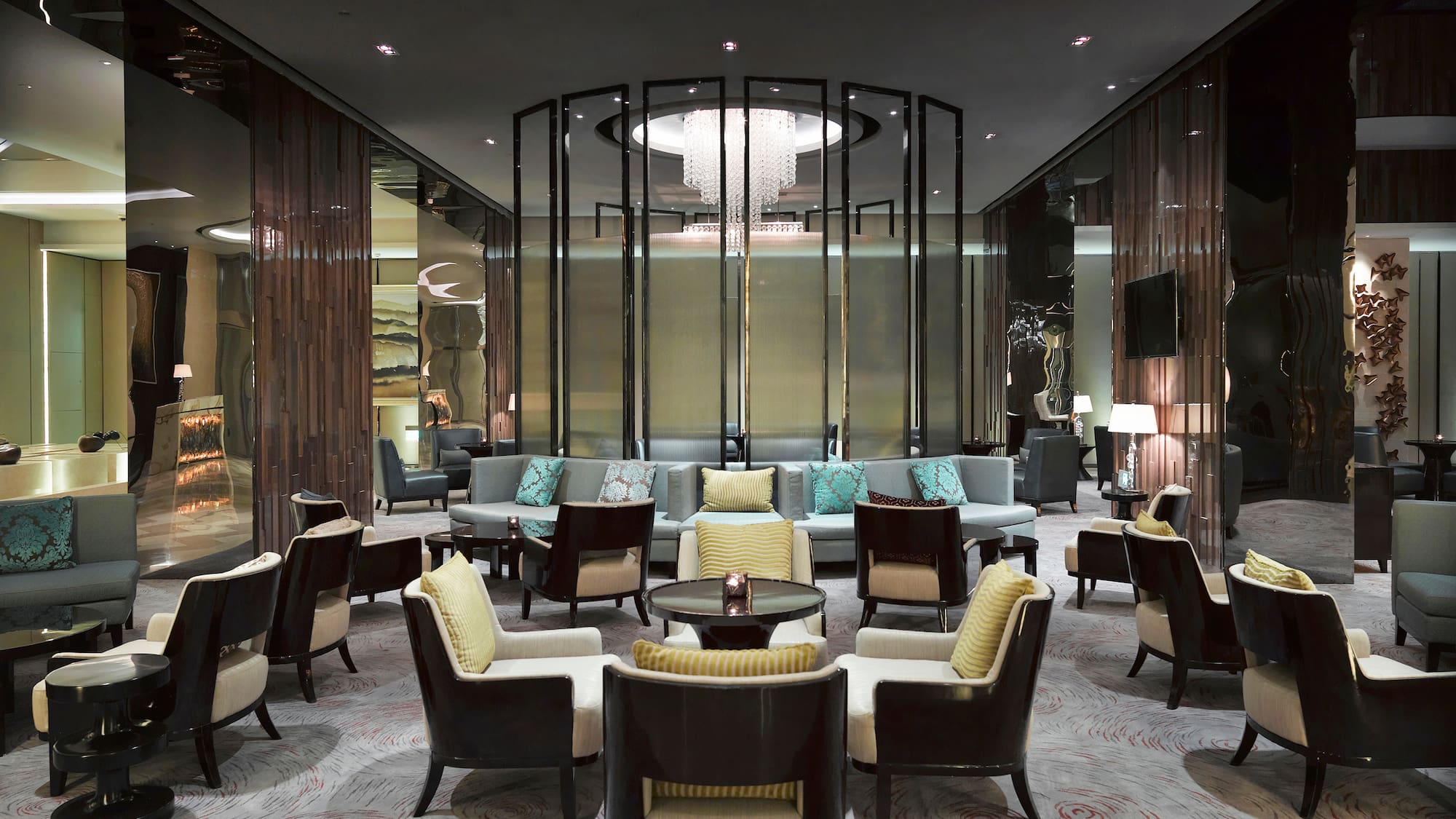 a room with a chandelier and chairs