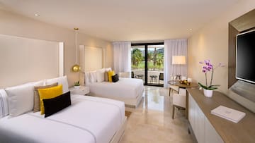 a room with two beds and a table