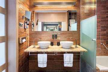 a bathroom with two sinks and a mirror