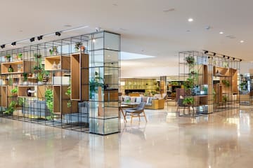 a room with glass walls and shelves