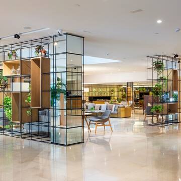a room with glass walls and shelves