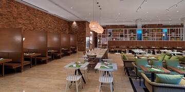 a restaurant with tables and chairs