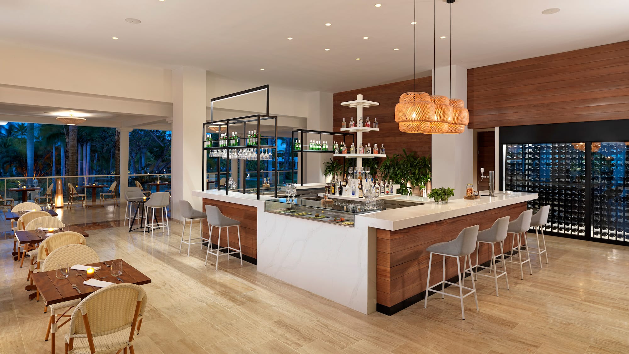 a room with a bar and chairs