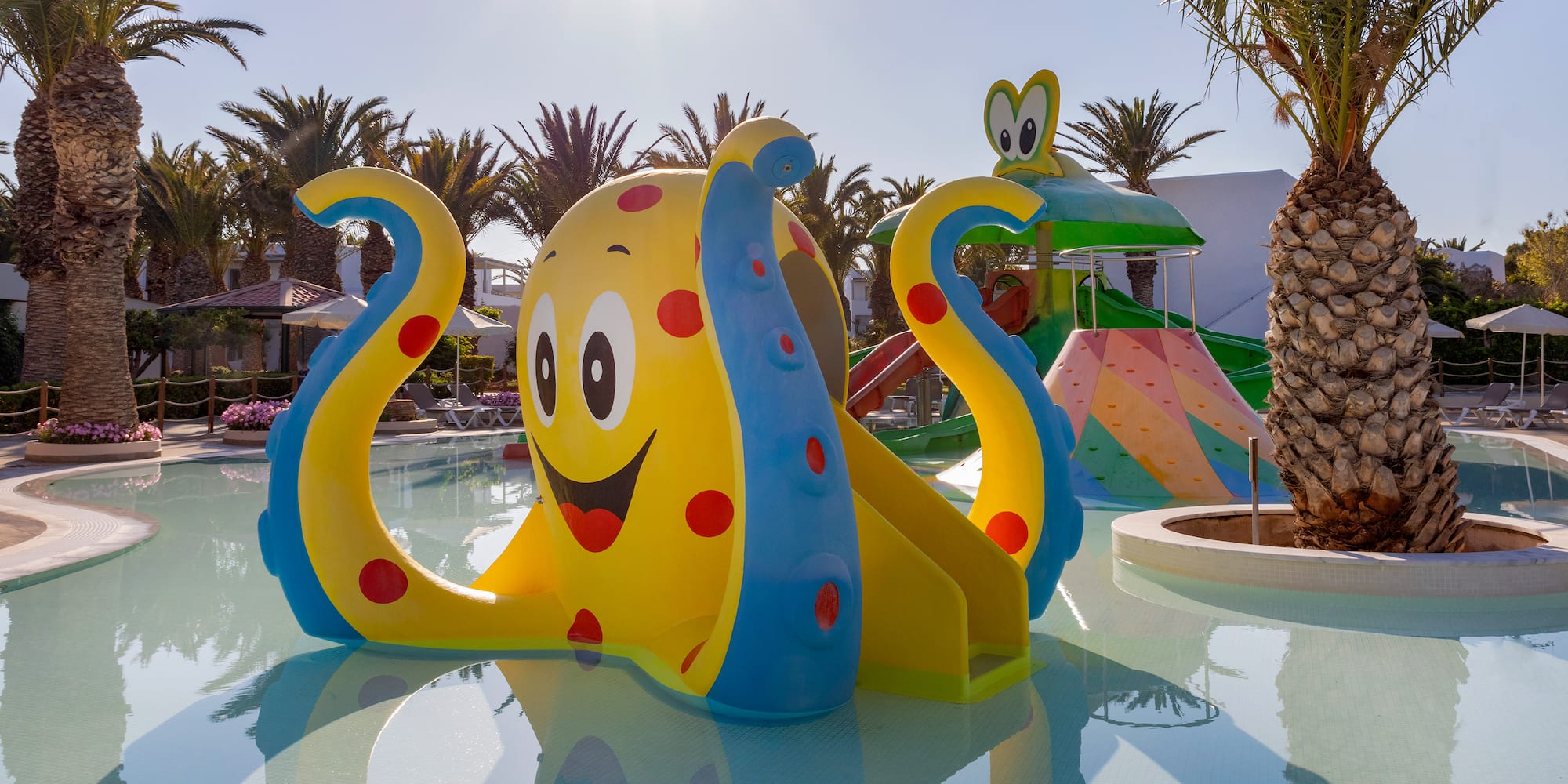 a water park with a slide and a slide