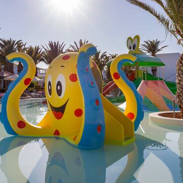 a water park with a slide and a slide